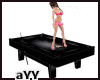 Black poses pool table